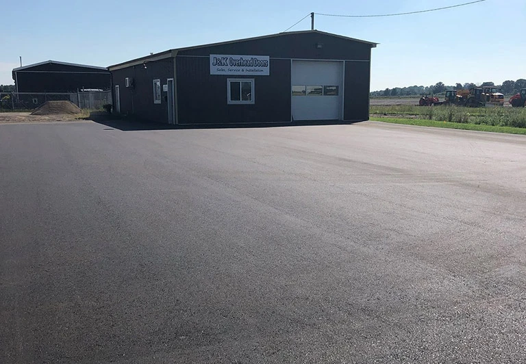 Durable commercial asphalt parking lot installation for a local business in Elgin County.