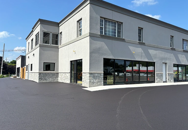 Newly paved commercial parking lot and entrance for a professional building in Simcoe, Norfolk County.