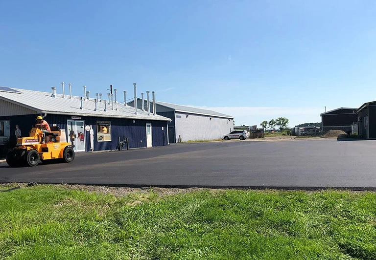 Long-distance asphalt driveway installation for a large rural estate in Norfolk County.