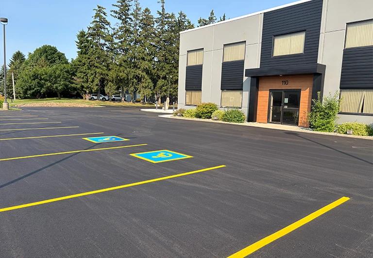Custom circular asphalt driveway installation for a premium estate home in Elgin County.